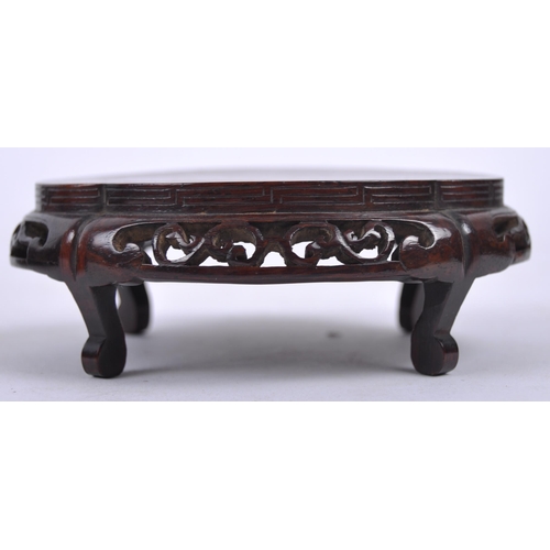 16 - A group of three Chinese carved hardwood stand dating from the 19th Century to include a large stand... 