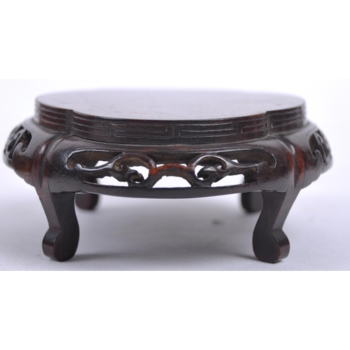 16 - A group of three Chinese carved hardwood stand dating from the 19th Century to include a large stand... 