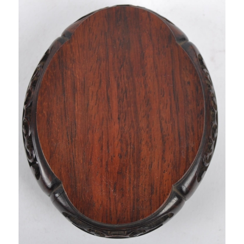 16 - A group of three Chinese carved hardwood stand dating from the 19th Century to include a large stand... 