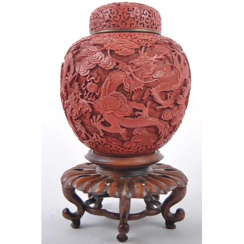 160 - A large Chinese 19th Century Cinnabar red lacquer ginger jar & cover raised on good quality pierced ... 