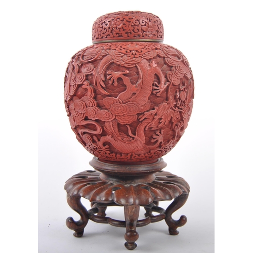 160 - A large Chinese 19th Century Cinnabar red lacquer ginger jar & cover raised on good quality pierced ... 