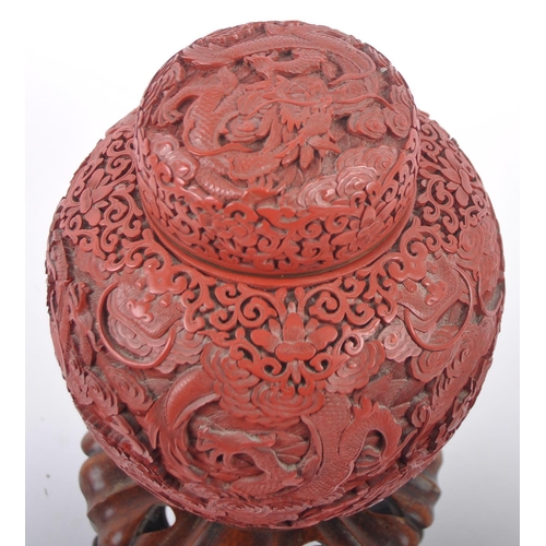 160 - A large Chinese 19th Century Cinnabar red lacquer ginger jar & cover raised on good quality pierced ... 
