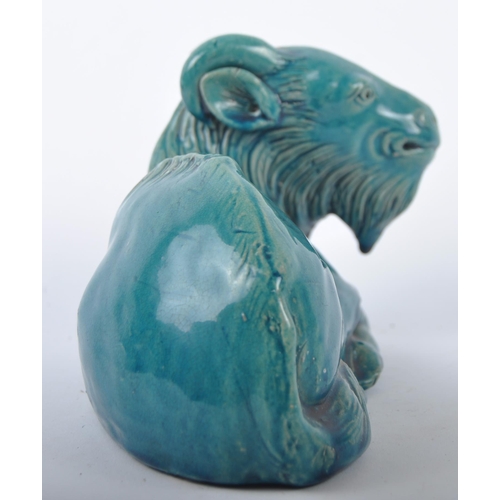 161 - A 19th Century Chinese monochrome pottery figurine depicting a Zodiac goat. Modelled reclined with e... 