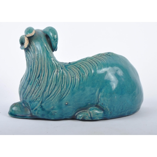 161 - A 19th Century Chinese monochrome pottery figurine depicting a Zodiac goat. Modelled reclined with e... 