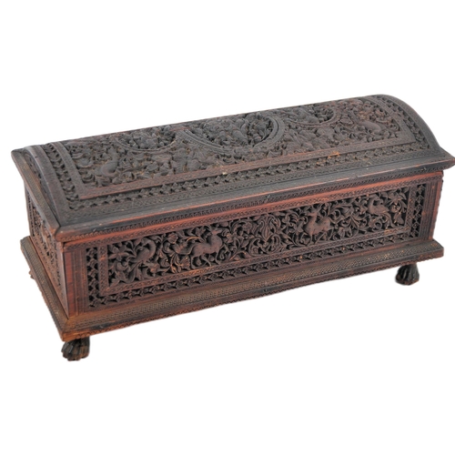 162 - A 19th Century Anglo-Indian colonial carved box having a domed top with intricately carved panel sid... 