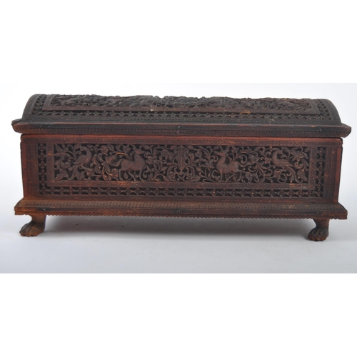 162 - A 19th Century Anglo-Indian colonial carved box having a domed top with intricately carved panel sid... 