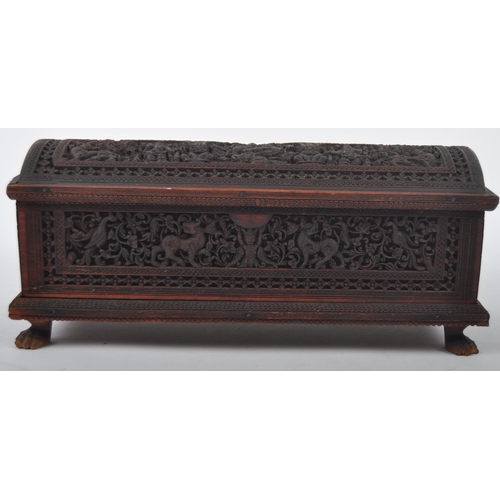 162 - A 19th Century Anglo-Indian colonial carved box having a domed top with intricately carved panel sid... 