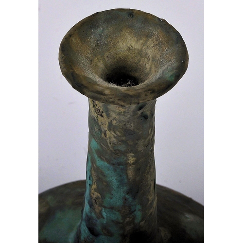 164 - A Chinese Oriental Han Dynasty manner pottery vase. Flared circular rim with long tapered cylindrica... 