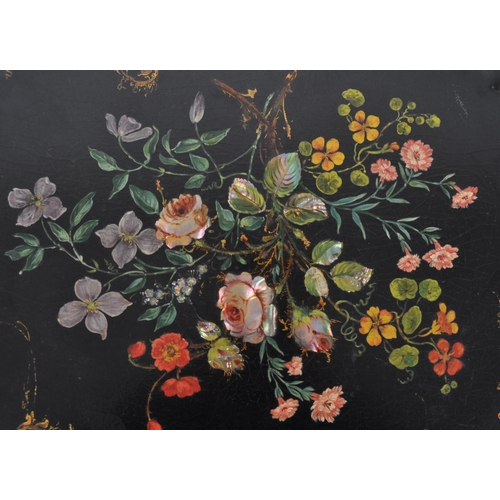 168 - An 18th Century Chinese black lacquer export papier mache tray of scalloped form. Central painted fl... 