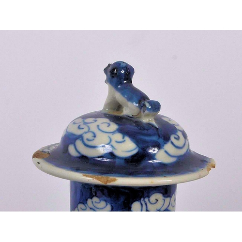 169 - A pair of 19th Century Chinese Kangxi mark blue & white porcelain vases and covers. Foo dog finial t... 