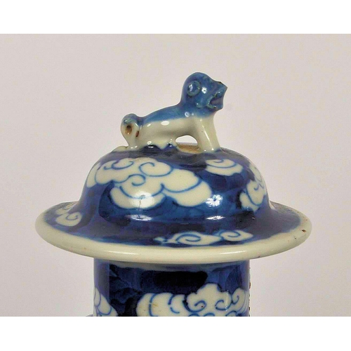 169 - A pair of 19th Century Chinese Kangxi mark blue & white porcelain vases and covers. Foo dog finial t... 