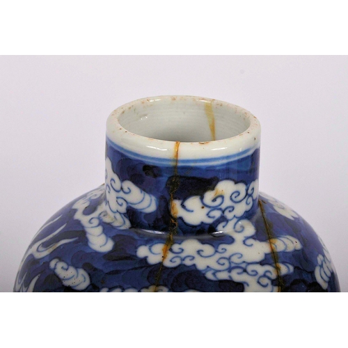 169 - A pair of 19th Century Chinese Kangxi mark blue & white porcelain vases and covers. Foo dog finial t... 