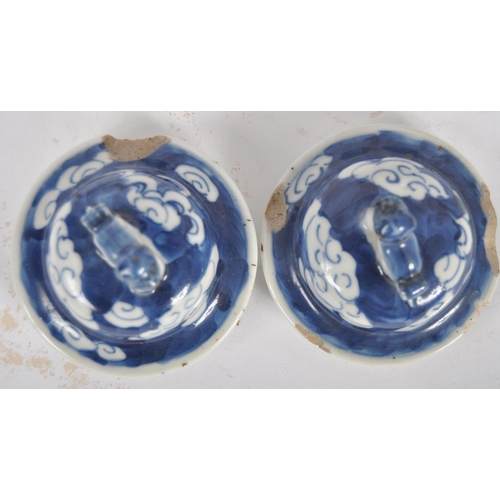 169 - A pair of 19th Century Chinese Kangxi mark blue & white porcelain vases and covers. Foo dog finial t... 