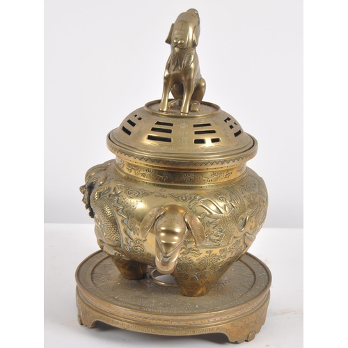 171 - A Chinese twin handled bronze incense burner.   With asynchronous floral décor to surround, depictin... 