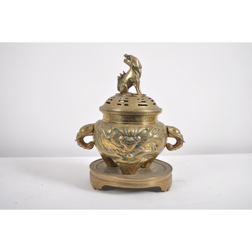 171 - A Chinese twin handled bronze incense burner.   With asynchronous floral décor to surround, depictin... 