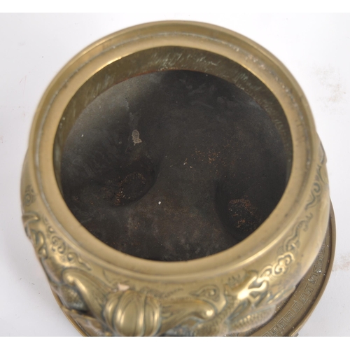 171 - A Chinese twin handled bronze incense burner.   With asynchronous floral décor to surround, depictin... 