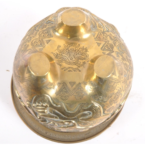 171 - A Chinese twin handled bronze incense burner.   With asynchronous floral décor to surround, depictin... 