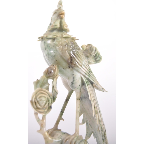 172 - An early 20th Century Chinese large carved jade figurine depicting a cockerel / rooster standing on ... 