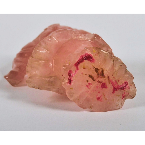 173 - A Chinese carved pink quartz figurine depicting Guanyin. Hand carved pink quartz figure raised on ca... 