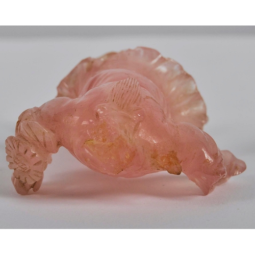 173 - A Chinese carved pink quartz figurine depicting Guanyin. Hand carved pink quartz figure raised on ca... 