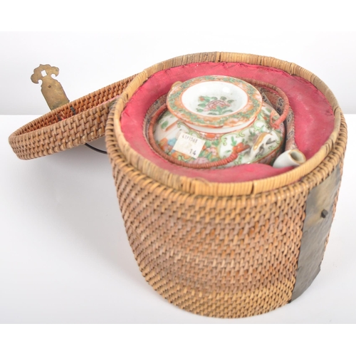 174 - A 19th Century Chinese Cantonese export porcelain famille rose medallion teapot held within the orig... 