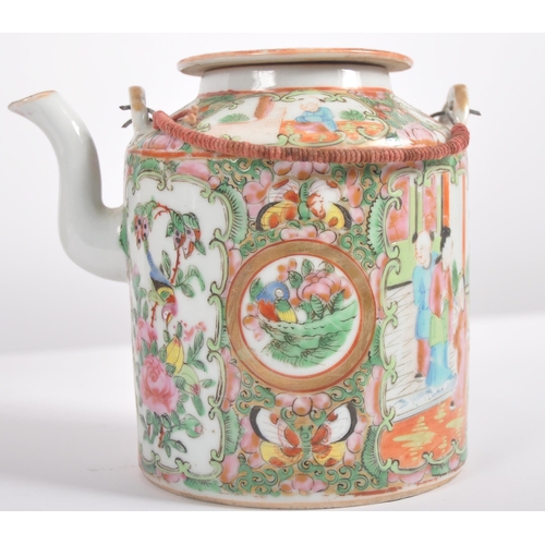 174 - A 19th Century Chinese Cantonese export porcelain famille rose medallion teapot held within the orig... 