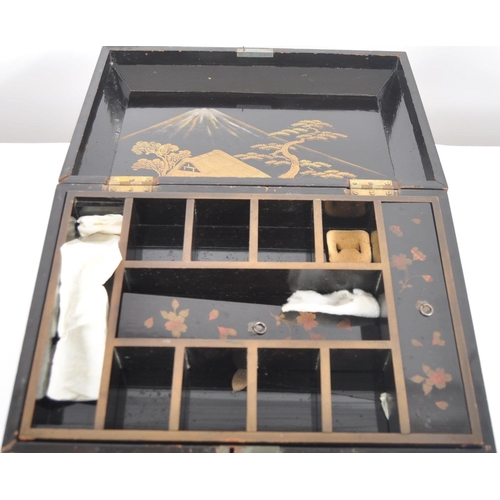175 - A 19th Century Japanese black lacquer box. Hand painted decoration throughout depicting landscape sc... 