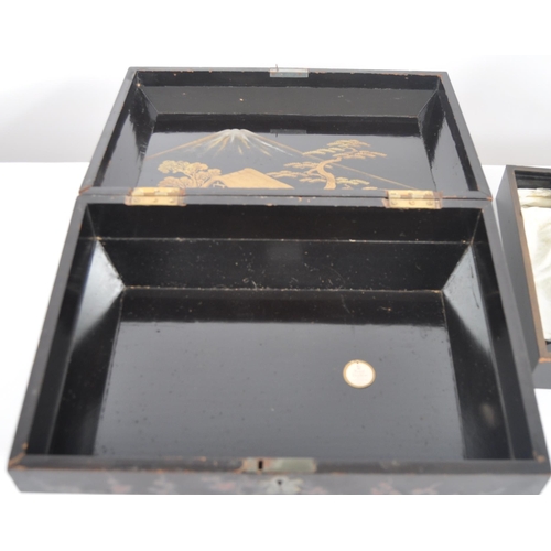 175 - A 19th Century Japanese black lacquer box. Hand painted decoration throughout depicting landscape sc... 