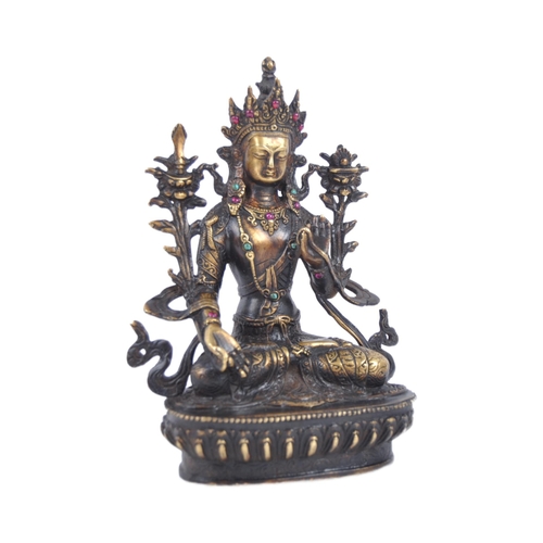 18 - A 20th Century Chinese bronze figurine of Buddha / Green Tara. The figure modelled in the Lotus posi... 