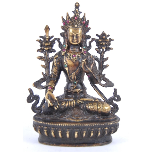 18 - A 20th Century Chinese bronze figurine of Buddha / Green Tara. The figure modelled in the Lotus posi... 