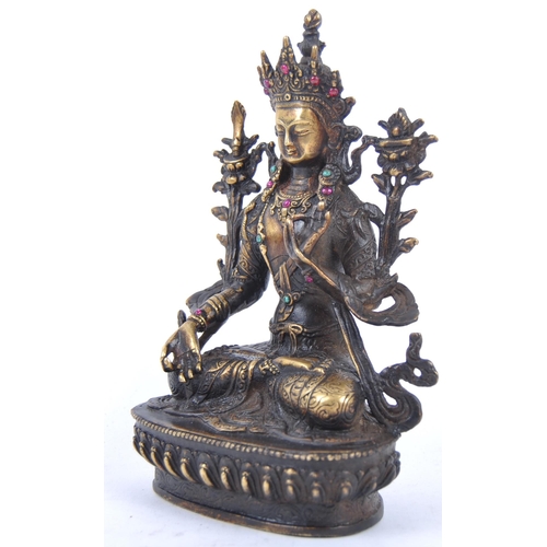 18 - A 20th Century Chinese bronze figurine of Buddha / Green Tara. The figure modelled in the Lotus posi... 