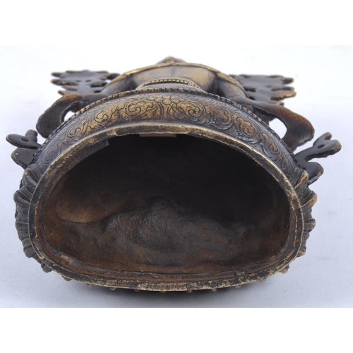 18 - A 20th Century Chinese bronze figurine of Buddha / Green Tara. The figure modelled in the Lotus posi... 