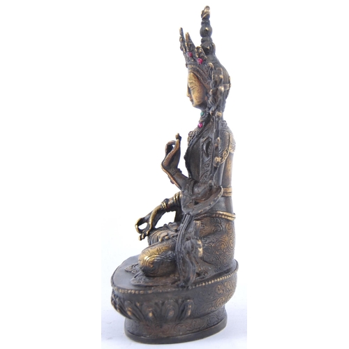18 - A 20th Century Chinese bronze figurine of Buddha / Green Tara. The figure modelled in the Lotus posi... 