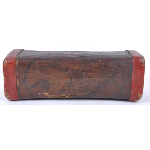 22 - A 19th Century Chinese papier mache & lacquer head rest pillow. Shaped form with red lacquer edges, ... 