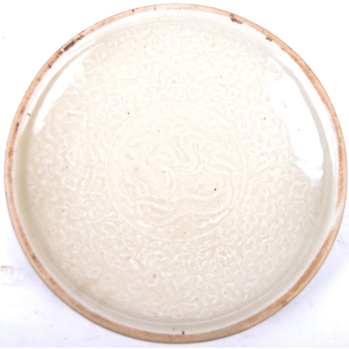23 - A Chinese Song Dynasty (believed) porcelain plate of circular form having a central depiction of a D... 
