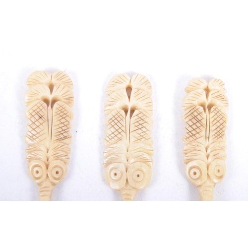 3 - A set of three 19th Century hand carved believed Maori carved bone spoons. Carved figural / mask for... 