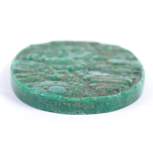 34 - An early 20th Century Chinese green carved malachite panel of oval form depicting dragon in clouds w... 
