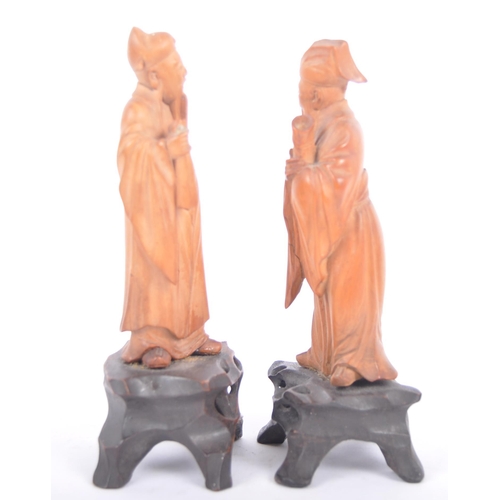 41 - A pair of good quality early 20th Century Chinese hand carved wooden figurines depicting elders / im... 