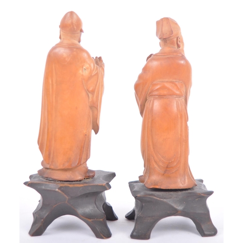 41 - A pair of good quality early 20th Century Chinese hand carved wooden figurines depicting elders / im... 