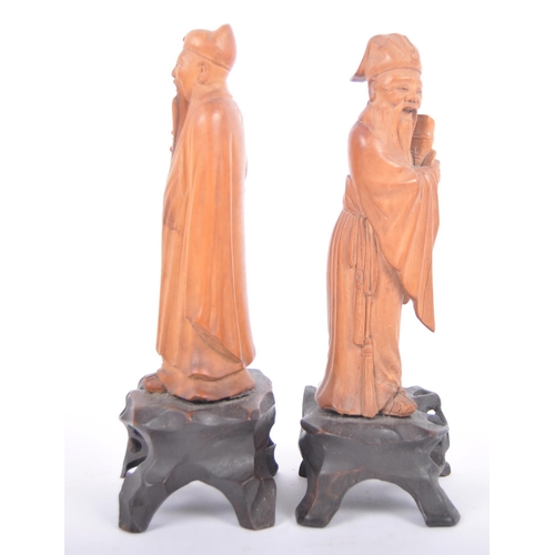 41 - A pair of good quality early 20th Century Chinese hand carved wooden figurines depicting elders / im... 
