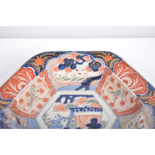 59 - A Japanese 19th century Meiji Period large Imari hexagonal centrepiece bowl. The bowl depicting trad... 