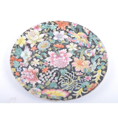 9 - A 19th Century Chinese famille rose mille fleurs plate, Qianlong mark naturalistically enamelled wit... 