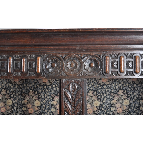 10 - A large 18th Century carved oak hall / livery cupboard armoire wardrobe. Flared carved cornice top w... 