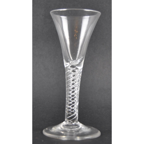 101 - An 18th Century multi spiral air twist wine drinking glass having a trumpet shaped bowl raised on ai... 