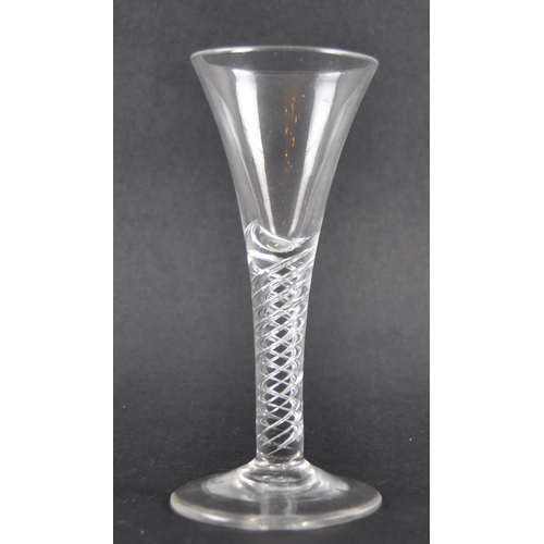 101 - An 18th Century multi spiral air twist wine drinking glass having a trumpet shaped bowl raised on ai... 