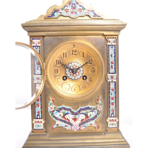 105 - A 19th Century French Champlevé enamel cloisonné work mantel clock having a gilded / lacquered brass... 