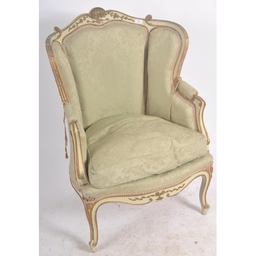 108 - A 19th Century French painted fauteuil wingback armchair. Carved shell back rail with cushioned back... 