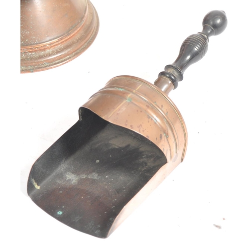 109 - A 19th Century Victorian copper fireside coal scuttle with coal scoop. Swing handle to top with rive... 