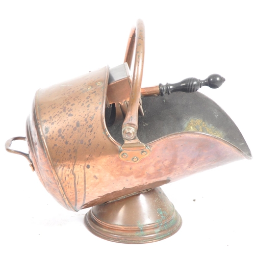 109 - A 19th Century Victorian copper fireside coal scuttle with coal scoop. Swing handle to top with rive... 