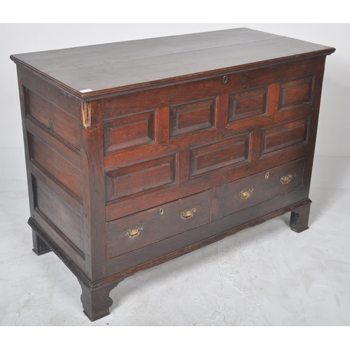 113 - An 18th Century George III oak mule chest coffer blanket box. Geometric block panelled front with tw... 